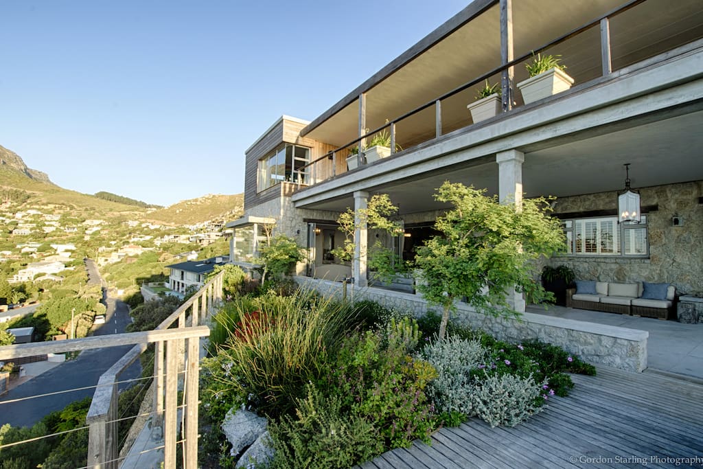 Enjoy the best views in Llandudno, perched on a rock, overlooking the beach, the mountain, and Robben Island in the distance...