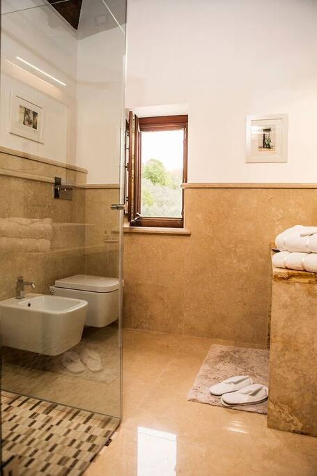 Luxury Italian marble bathrooms with walk in showers
