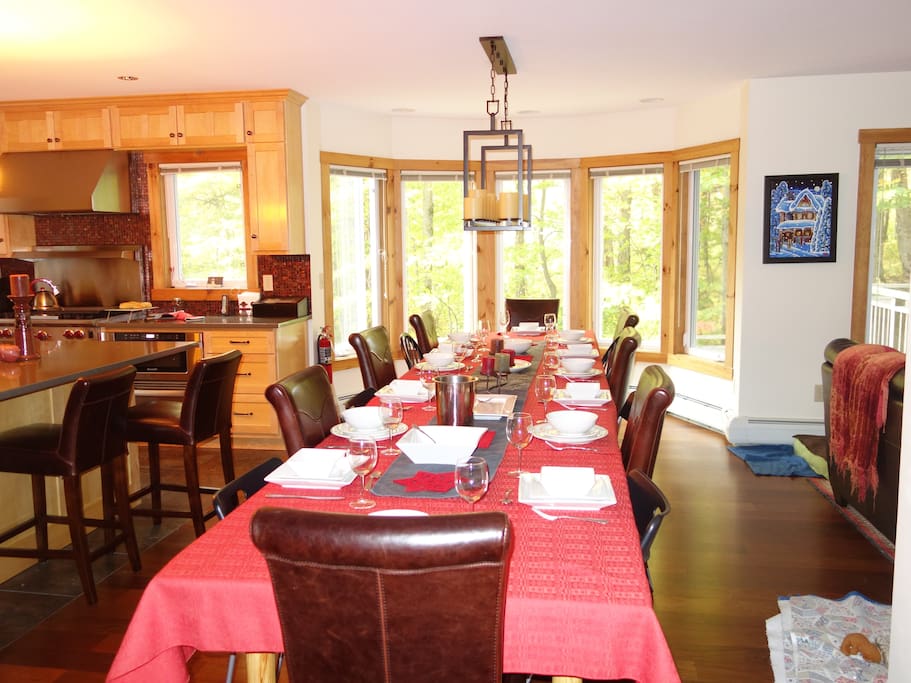 The dining room welcomes 14-16 guests + 4 on the kitchen island