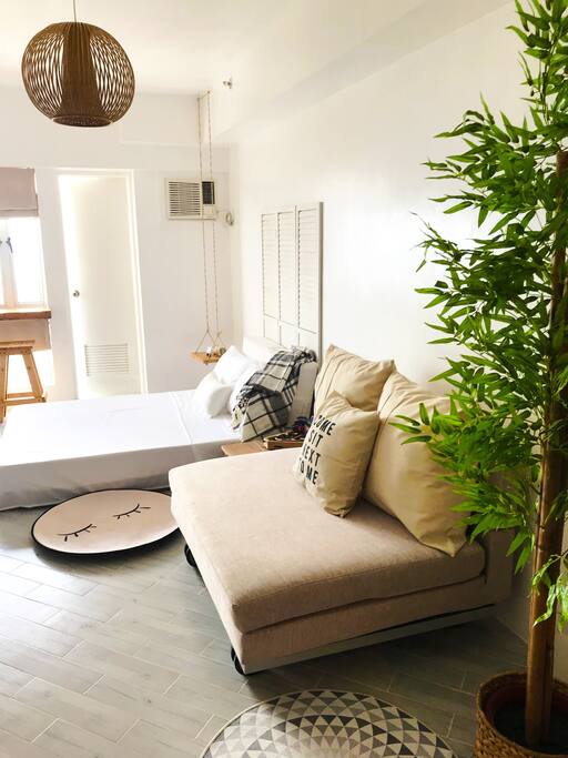 The main bed is right beside the window and balcony door for that cool Tagaytay breeze