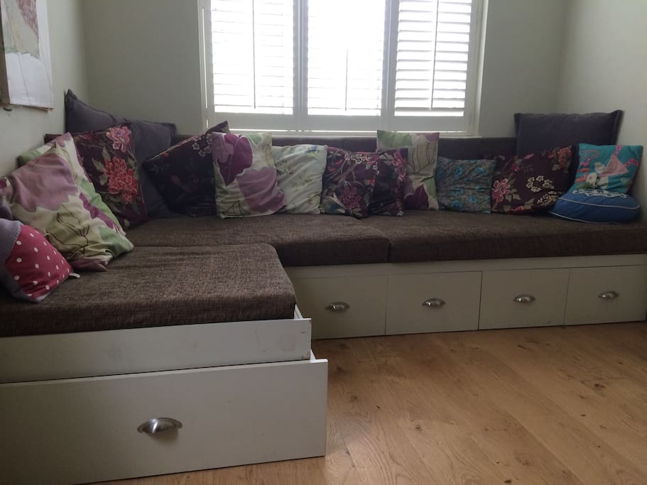 Downstairs TV room, doubles up as single bed, or two children.