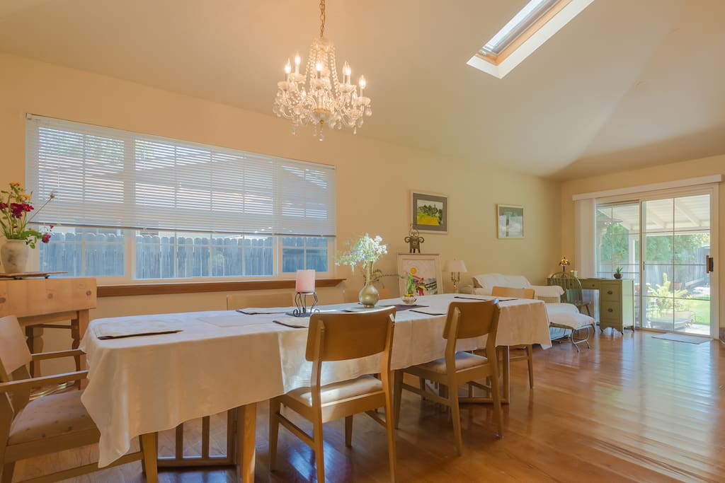 Family room formal dining room and guest seating area and work desk facing back yard