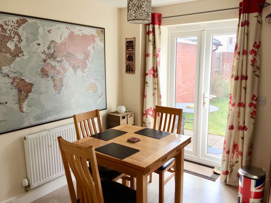 Dining area within the kitchen. Feel free to sit here to eat if you wish (and you can plan your next holiday by gazing at my lovely world map!)