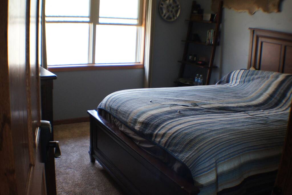 Large Bedroom on second floor (#2) with windows facing the wooded lot
