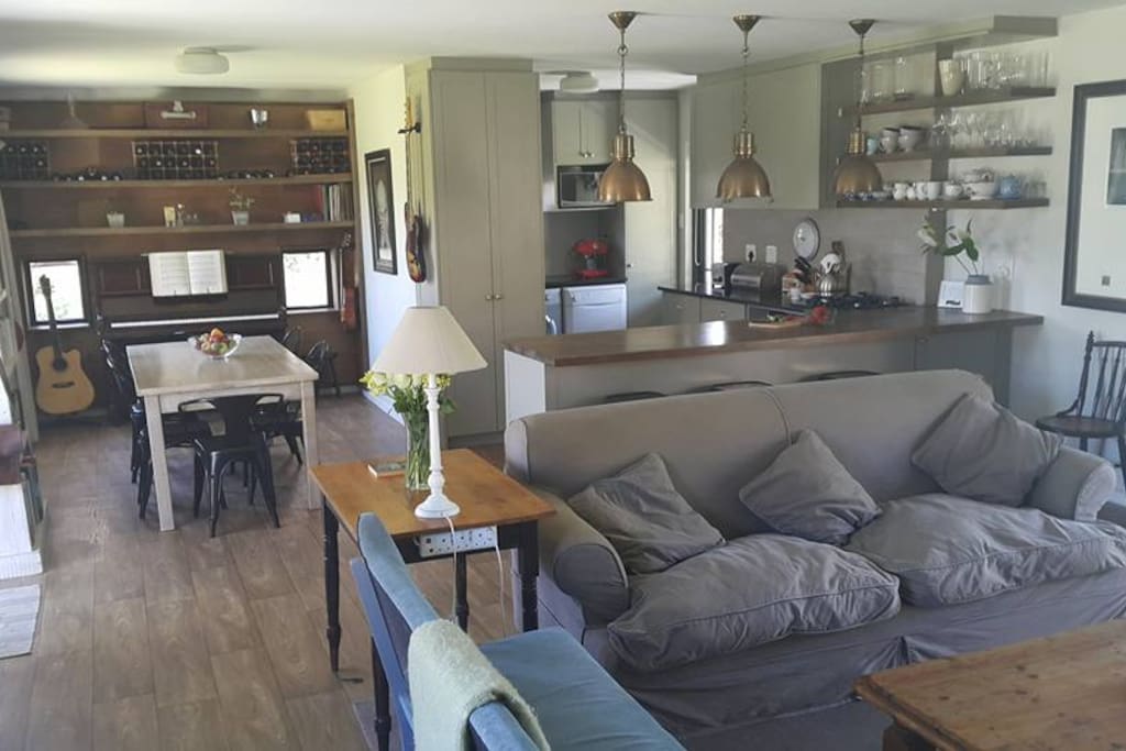 Open plan living area with well equiped kitchen