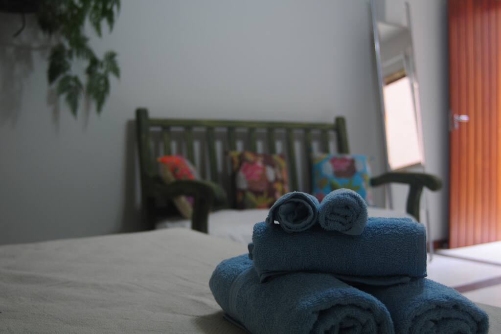 In addition to queen bed, room has a large sofa. All linen and towels provided