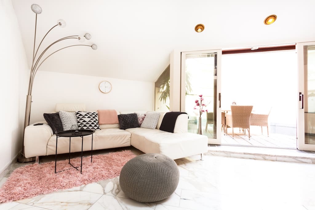 The sofa in the living room may be pulled out for more leg room while watching movies or playing games on the PS4. There is also a direct access to the private terrace with BBQ.