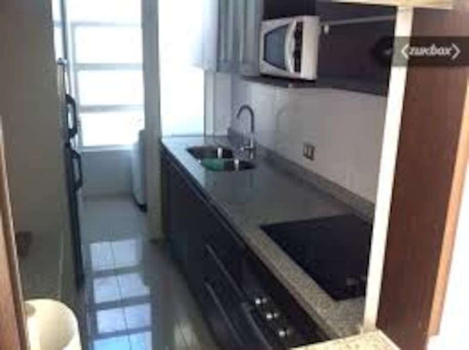 Modern, Large Kitchen and Area to Wash Your Clothes