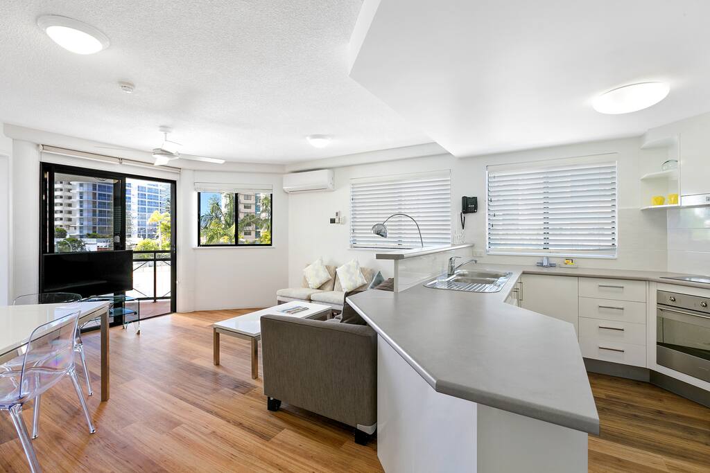 Open plan living with dining for four and a fully self-contained kitchen