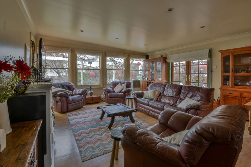 Large family room with plenty of seating and natural light