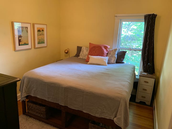 Bedroom 1, king bed. This bedroom has one door to the living room, and one door to the hallway. 