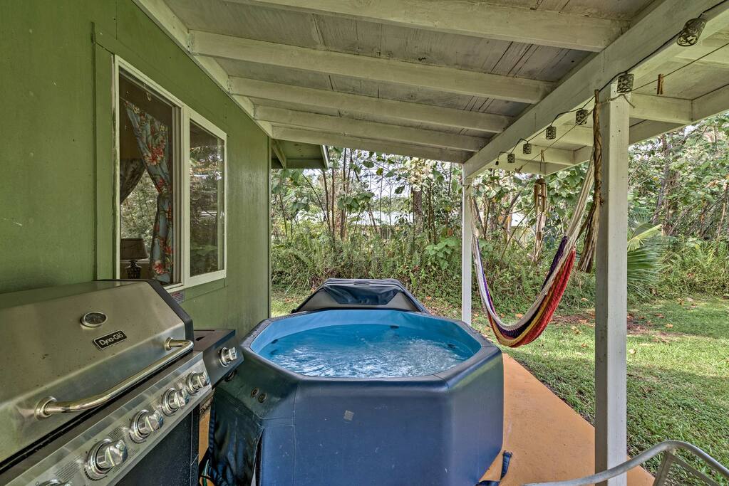 The backyard features a hot tub, gas grill and hammock.