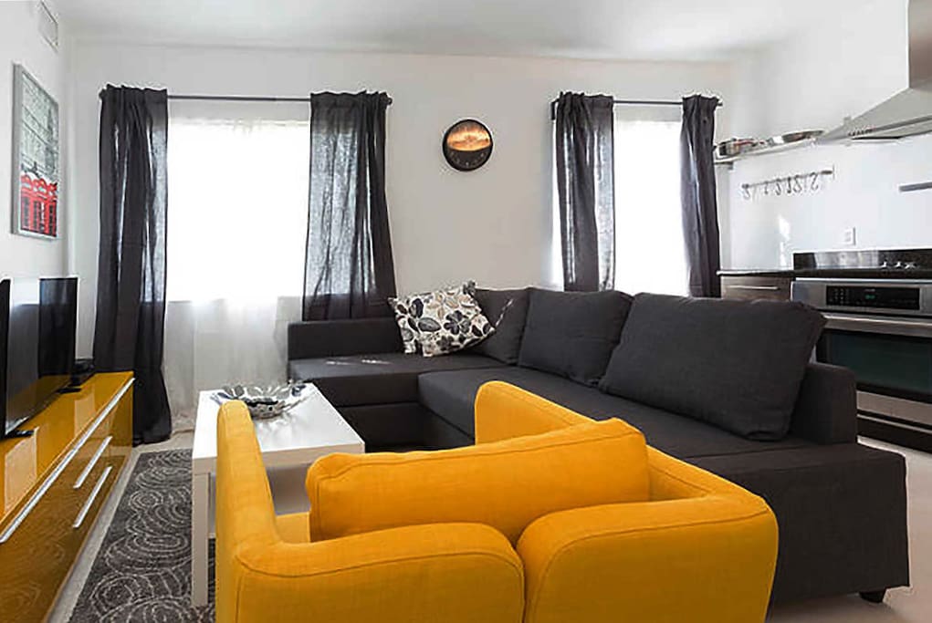 Stylish living area with TV and a sofa bed