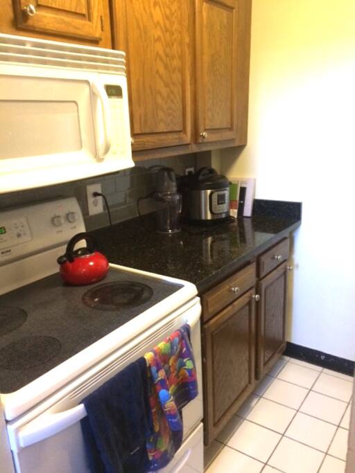 Full Equipped kitchen with pressure cooker, slow cooker, pots, pans, etc.