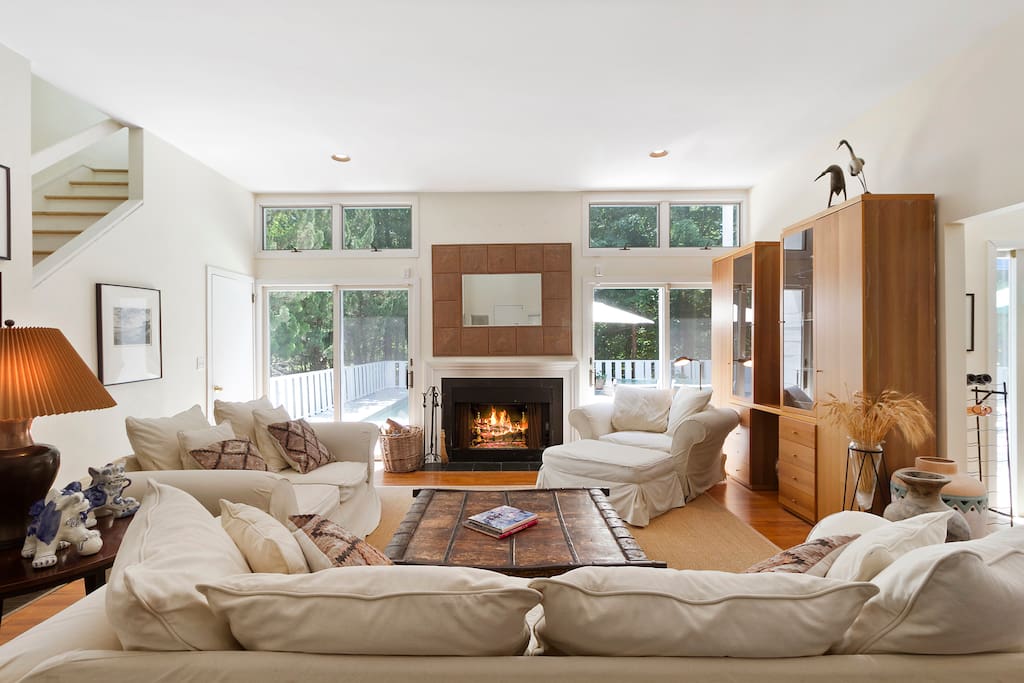 Easy living in the Hamptons. Double height living room opens onto spacious deck and pool