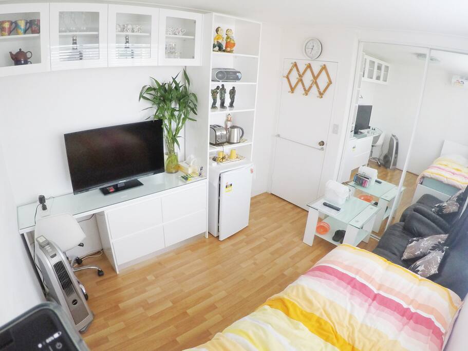 Single private room. Includes fridge, tv, couch, desk, wifi and bed.