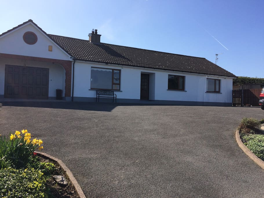 Welcome to my home. You can book the entire house while I live in the attached granny flat (double garage doors) to the left of the picture. The only access between my living space will be locked for your entire stay.