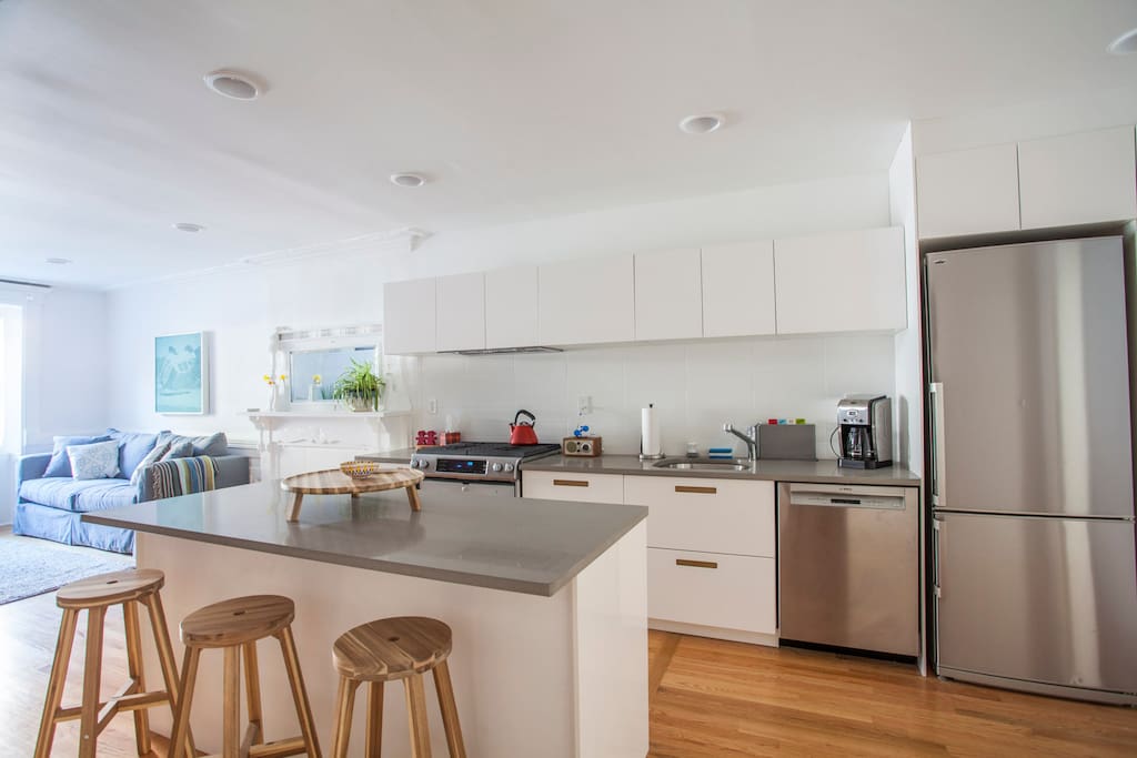 Gourmet kitchen with island, dishwasher and all new appliances.