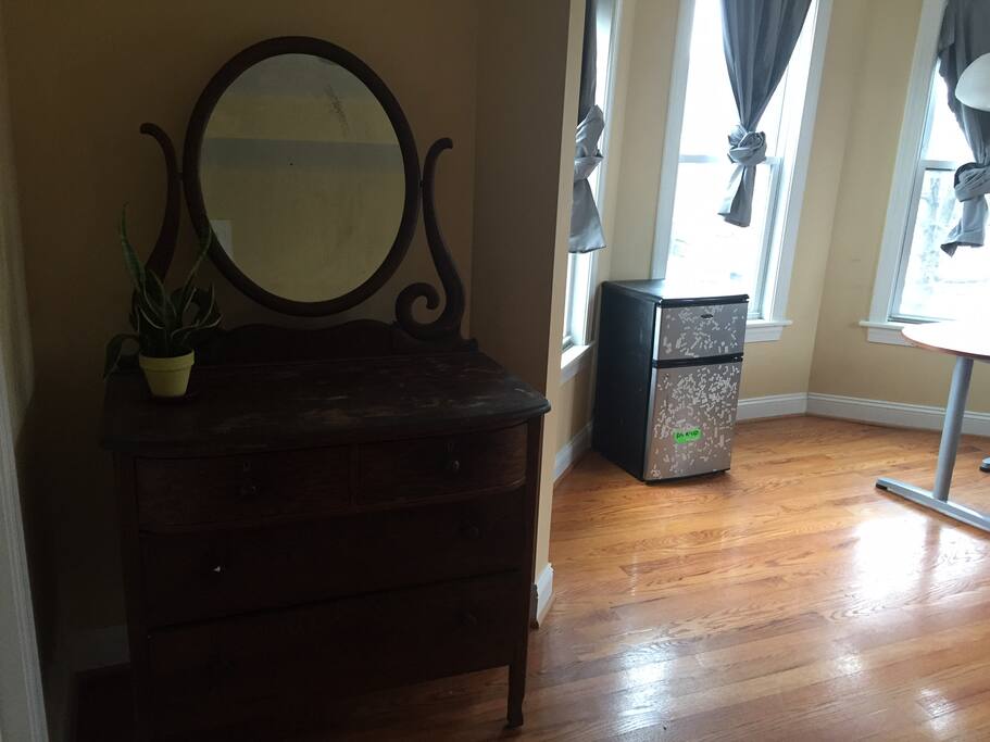 Beautiful dresser and functional mini-fridge available for your use
