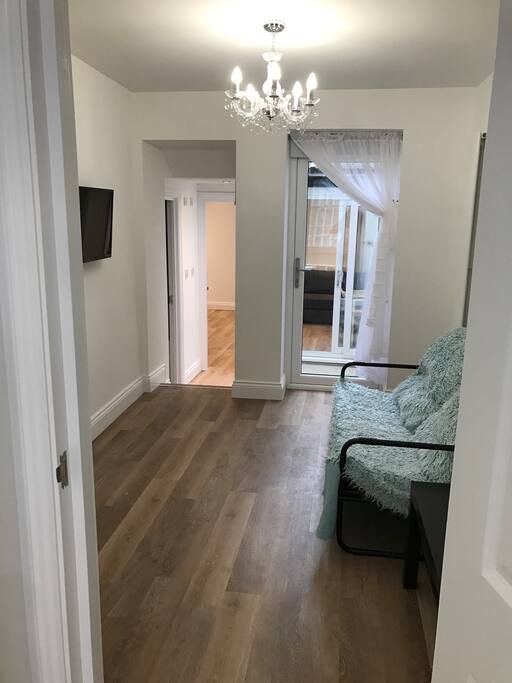 View from bedroom door into tv lounge.
