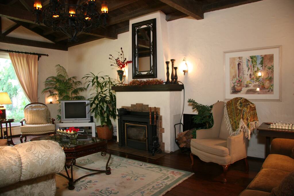 Make yourself feel at home in the spacious and comfortable living room with working fire place (TV has been updated since this picture was taken).
