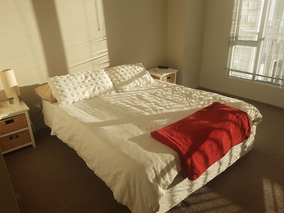 spacious sunny bedroom with ensuite