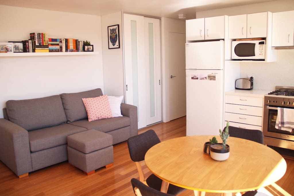Lounge, dining and kitchen with storage and internal laundry in the hallway