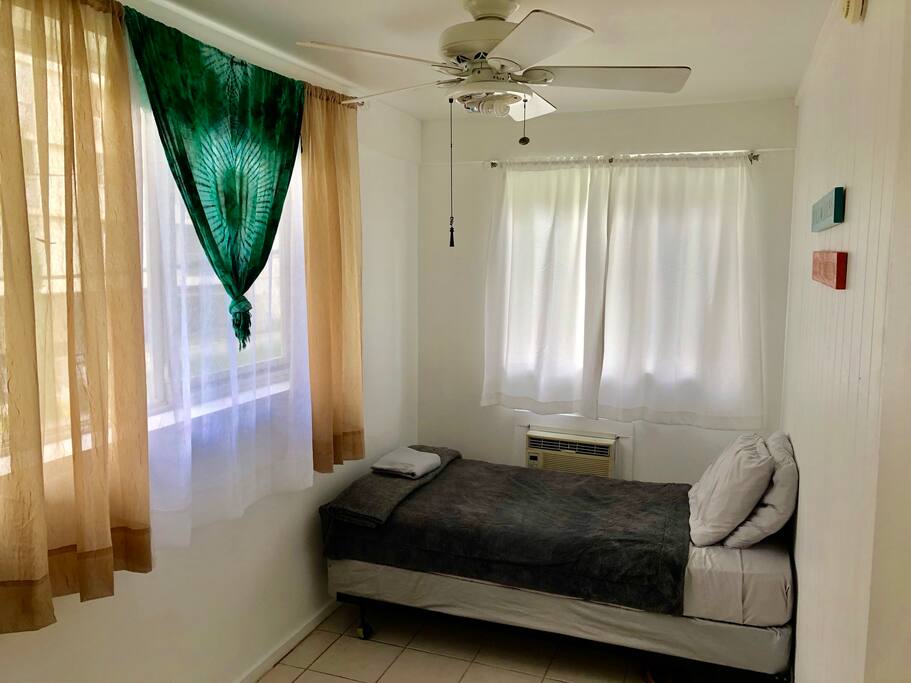 Two windows perfect for natural lighting and some island breeze.