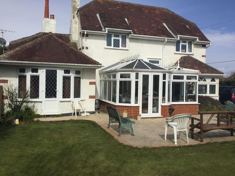 Breakfast is served in the conservatory accessed from the patio.