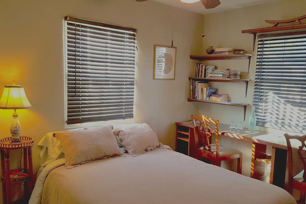 Your room has a new organic cotton queen size bed and a wall to wall counter top with 2 chairs.