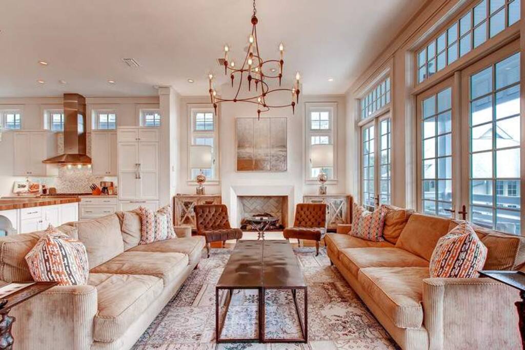 The 2nd floor living area has a fireplace and flatscreen TV, and opens up to a large balcony