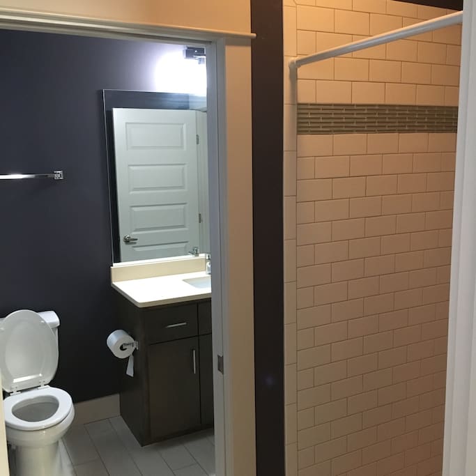 Self contained bathroom with gorgeous shower and sink.