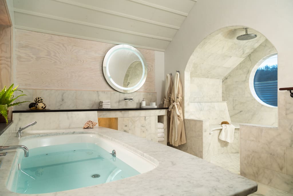 The ultimate in luxury. The Tree House at Bridgeton House with oversized 2 person Jacuzzi tub and marble rain shower with heated seats - both with river views.