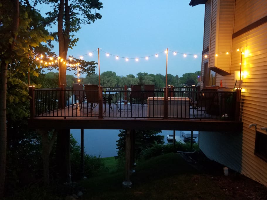 Huge patio has hamerschlagen, outdoor couches, large table, outdoor blue tooth speakers and lights