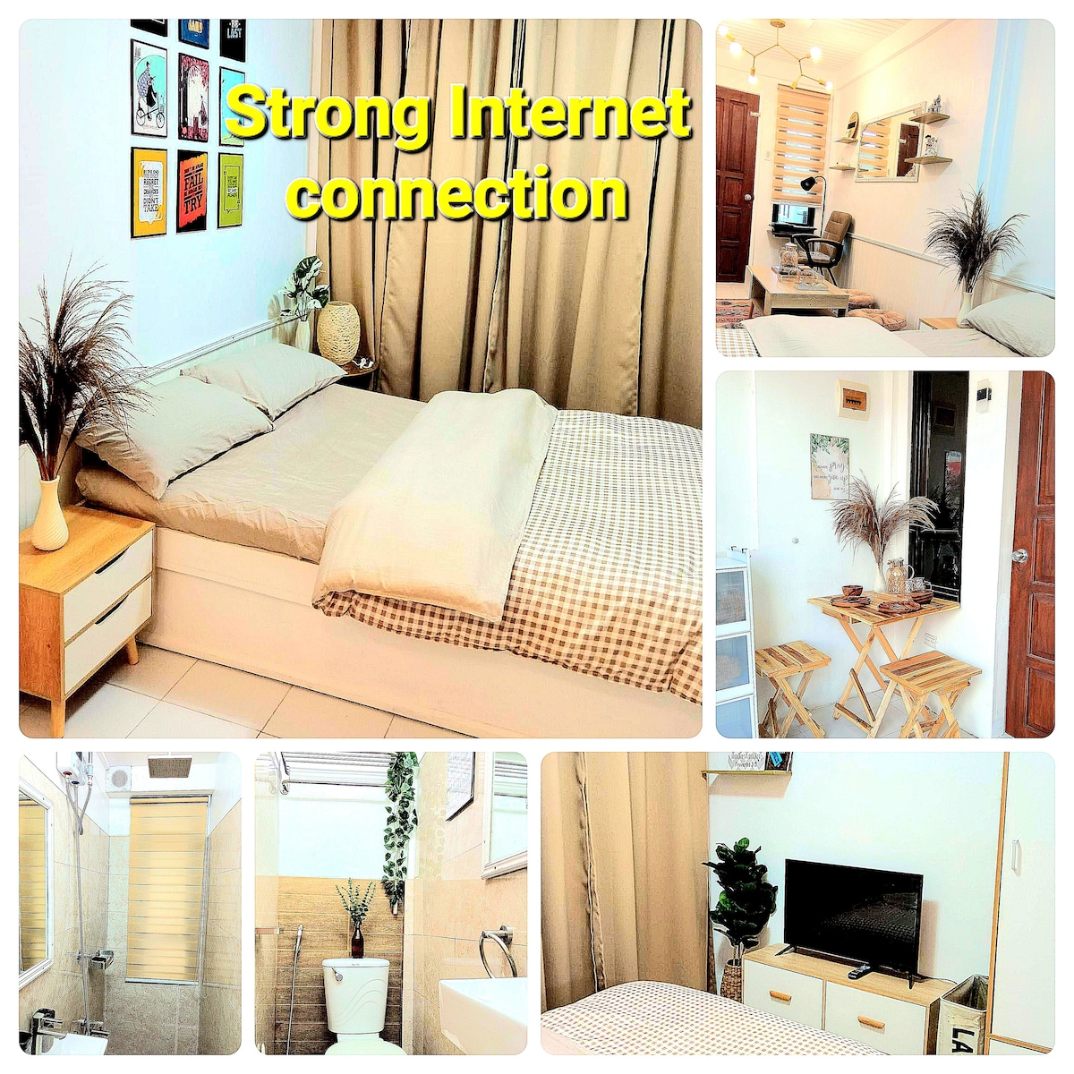 A cozy sleeping area is highlighted by a spacious bed topped with neutral bedding. A workspace is seen in the corner, featuring a desk and chair. Light tones throughout the space complement the clean, modern design. A bathroom with neutral tiles is also visible.