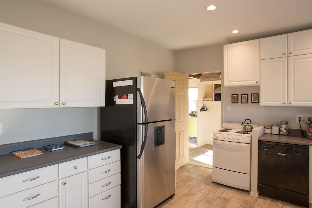 Modern appliances include filtered water and ice maker, toaster oven, cooking range and dishwasher and microwave. And a modern coffee maker with pods for convenience.