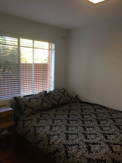 Bedroom 2, queen size bed with built in wardrobes.