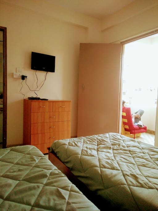 THE BEDROOM WITH AN OPENING TO BALCONY AND WITHOUT A SHELF