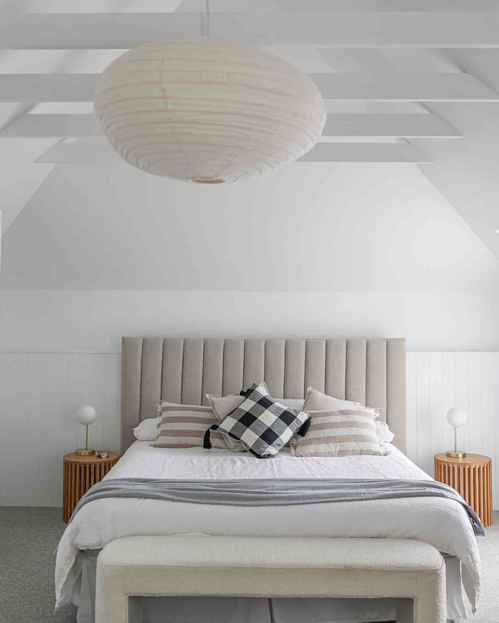Huge main loft bedroom with king bed and small office area in dormer window overlooking the tennis court. Water views.