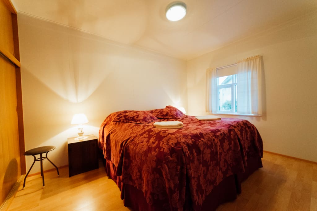 Bedroom with a king size bed, hanger and closet