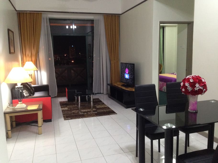 living room with satellite channel on flat screen tv