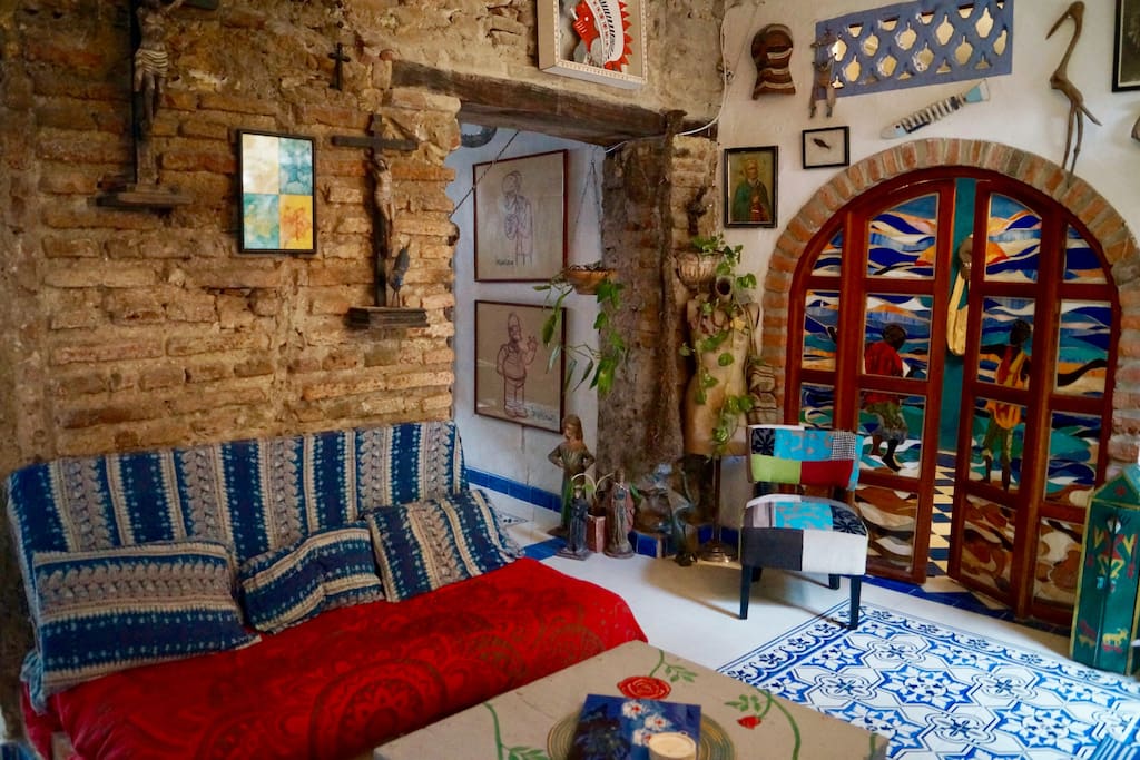 Living room with original Spanish Colonial wall