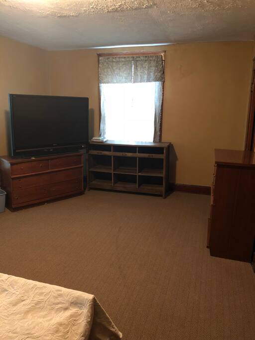 (2nd view)Bedroom #3 has a King size bed with dresser drawers and closet space along with a flat screen TV. VERY SPACIOUS!! A personal door “lock key” will be issued to make your room a private stay. 2nd floor