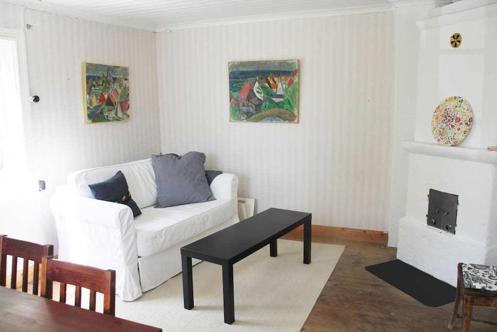 Living room with a working open fireplace, a dining table and a sofa.
It is a sofa bed (if you are 6-7 people... though we recommend 4-5 people in the house and just use this as a regular sofa)
