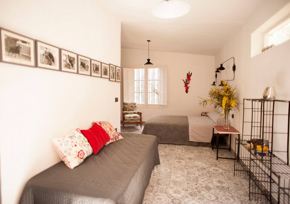 Bedroom with one double bed and one single bed