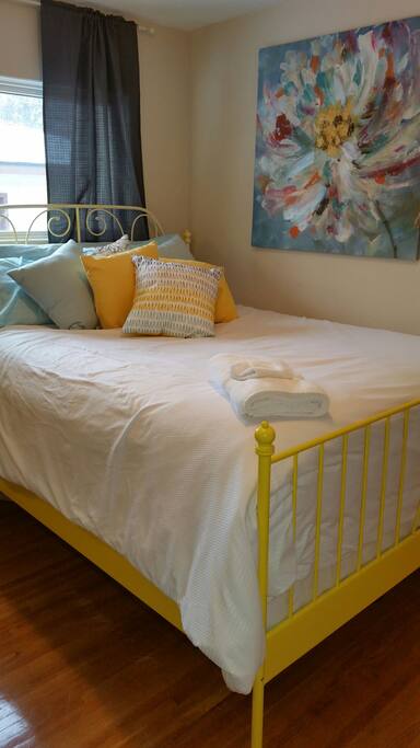 Pillowtop queen bed with west window.