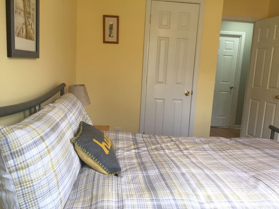 Newly painted full sized bed with new carpet.