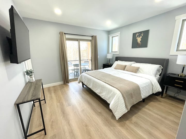 Master bedroom suite includes a king bed and direct access to the covered porch.