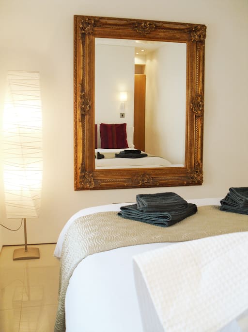 Beautiful mirror in a fantastic bedroom. Professional Hairdryer for you to look your best.