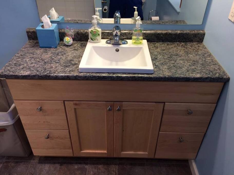 Private bathroom with blow dryer, towels, face cloths